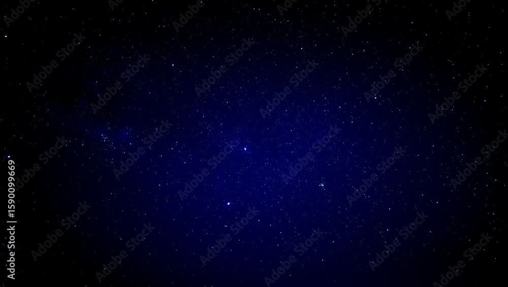 Fototapeta premium Cosmic Tapestry: A Deep Blue Field of Distant Stars, Celestial Symphony: A Night Sky Aglow with Countless Points of Light