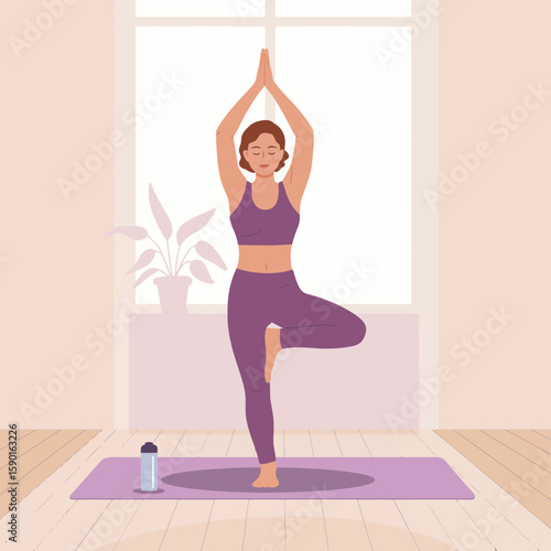 Woman practicing yoga tree pose indoors with plant and water bottle