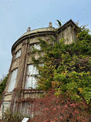 Photos Overgrown Round Building with Ivy