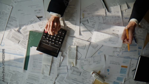 Accountant calculating corporate budget planning money profit at table top view