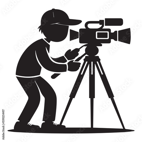 Silhouette of a person wearing a baseball cap operating a professional video camera mounted on a tripod capturing footage for a film or broadcast