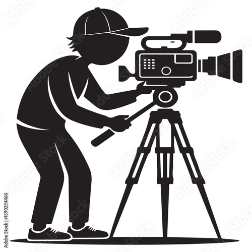 A silhouette of a person wearing a baseball cap operating a professional video camera mounted on a tripod capturing a moment