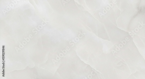 Abstract close-up of white onyx stone with subtle veining and smooth, flowing patterns creating a soft, elegant texture.