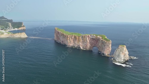 Aerial view orbiting around the Rocher Percé in Gaspésie