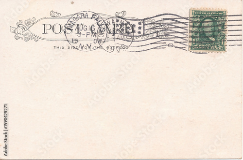 Old vintage postcard back with postage stamp