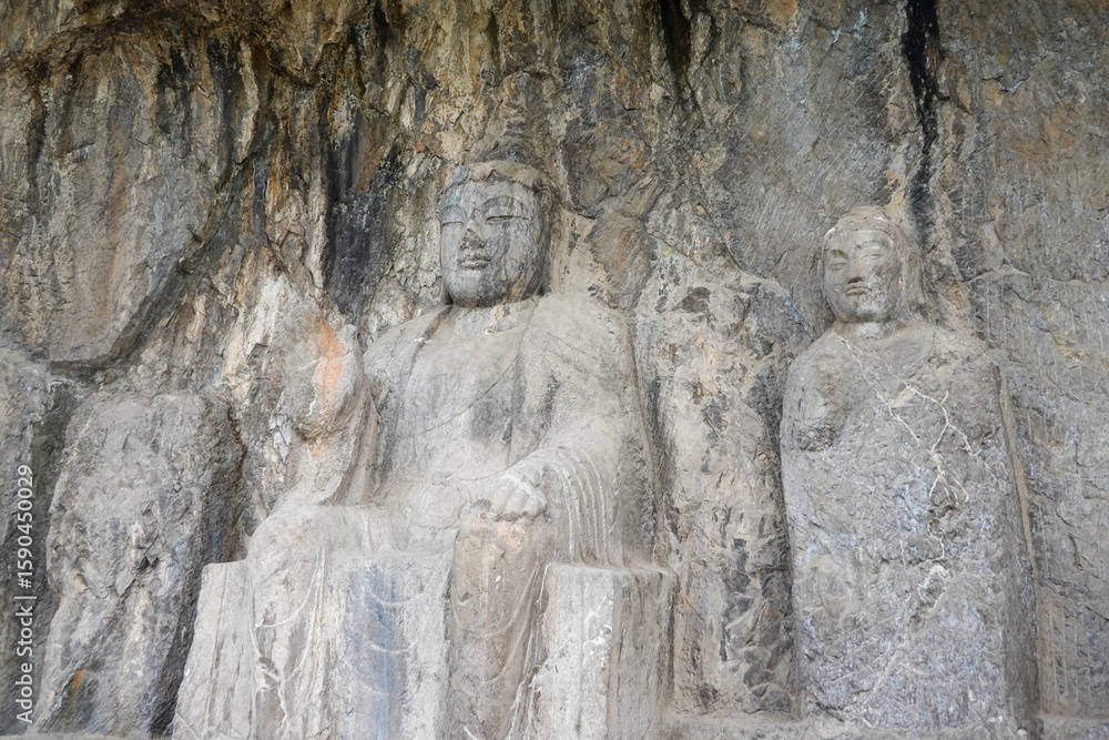 Naklejka premium Well-Preserved Buddhist Triad in a Grotto Sanctuary