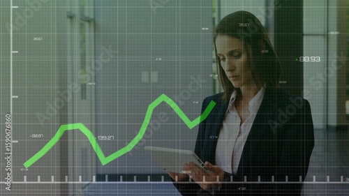 Businesswoman tapping tablet and analyzing grid overlay and line graph fluctuating business data