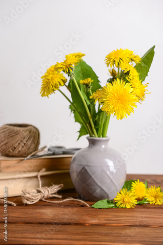 Vase with yellow dandelion ...