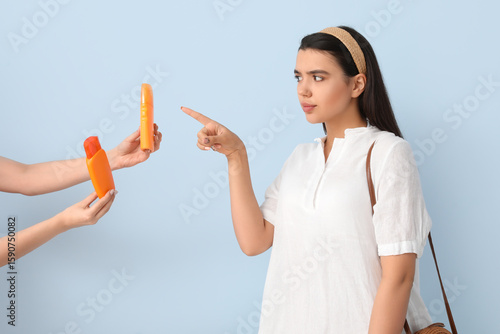 Beautiful young woman choos...