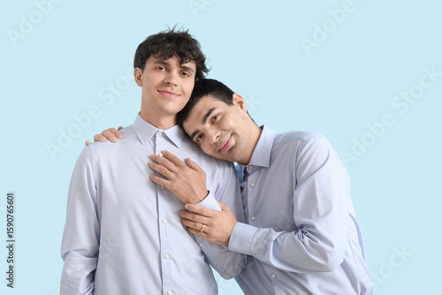 Married gay couple hugging ...