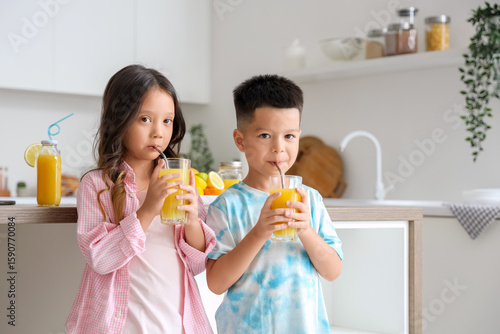 Little Asian children drink...