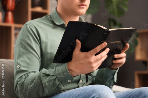 Young man with Holy Bible p...