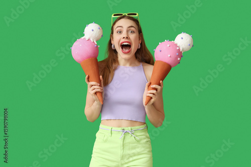 Surprised young woman holdi...