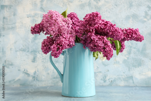 Jug with blooming lilac flo...