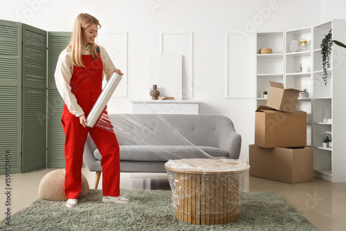 Female worker wrapping coff...