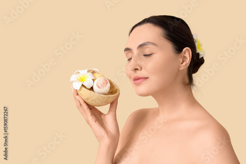 Young woman with bath bombs...