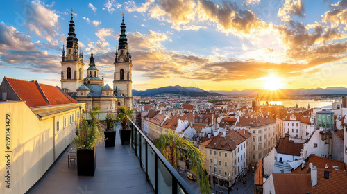 Wallpaper Mural Panoramic view of old town rooftops and skyline at sunset with vibrant clouds and mountains Torontodigital.ca
