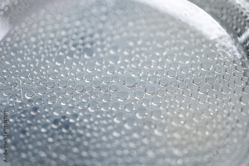 Close-up shot of water droplets stuck on a plastic sheet. Close-up shot.
