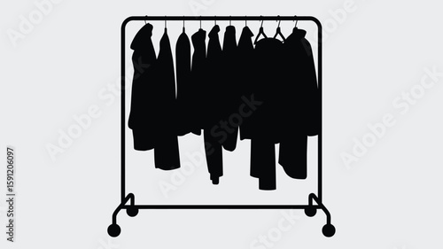 Silhouette of Clothes Hanging on a Garment Rack