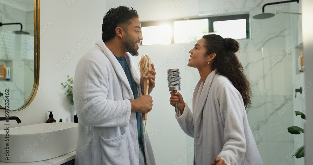 Fototapeta premium Couple, dance and singing in bathroom with love, energy and excited with morning routine. Brush, man and woman in home with music for celebration, karaoke rhythm and bonding with partner for romance