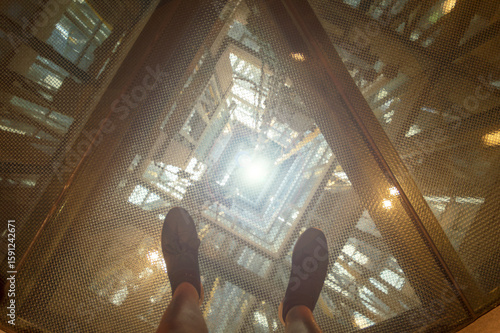 image of an elevator shaft seen from above on safety glass
