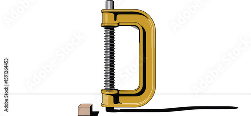 A yellow c clamp pressing a small wooden block against a white surface with a grey background area