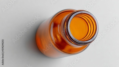 Wallpaper Mural Amber glass bottle viewed from above on a light grey surface container Torontodigital.ca