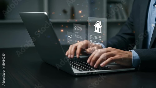 Businessman typing on a laptop, analyzing real estate data with holographic interface displaying house icon and charts
