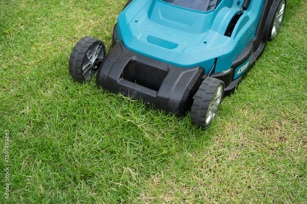 Lawn mover machine cut green grass, Hobby planting home garden. Lawn mover machine cut green grass, Hobby planting home garden.