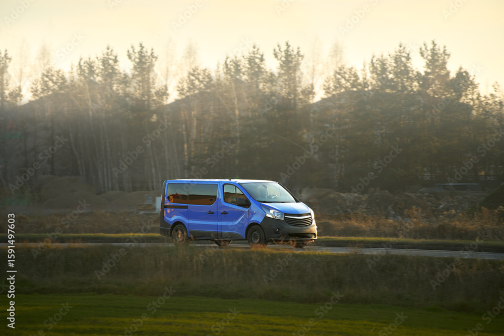 Fototapeta premium Commercial transport van traveling through nature