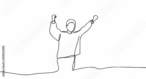 A person celebrates with arm raised.
