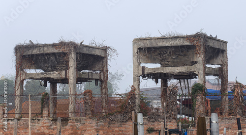 Two large and old abandoned concrete structures in the middle of Venice