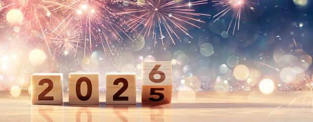 2026 New Year Celebration - Wooden Number Blocks And Fireworks At Eve Night With Abstract Defocused Lights