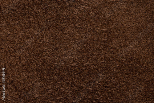 Genuine suede, brown color. Background or texture sample. Studio shot.