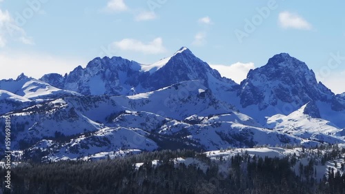 Wallpaper Mural The Hemlocks Mammoth Mountain ski snowboard resort aerial drone California Minarets jagged towering peaks clouds moving winter sunny blue sky afternoon fresh deep snow static shot Torontodigital.ca