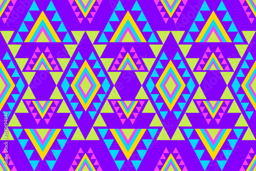Geometric seamless pattern with colorful triangles and diamonds on a purple background modern tribal design