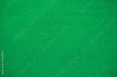 Green felt fabric background texture.