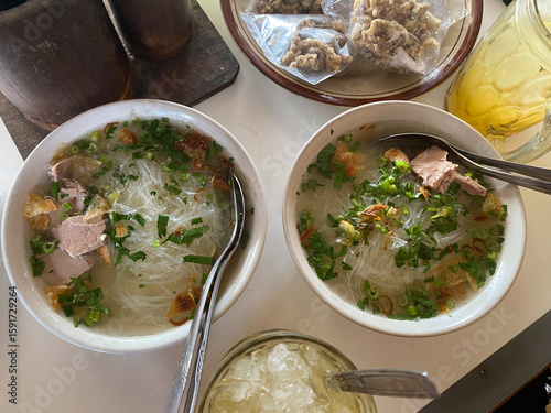 Soto Daging Sapi. Indonesian Food in a white bowl. Traditional Beef in a clear soup.