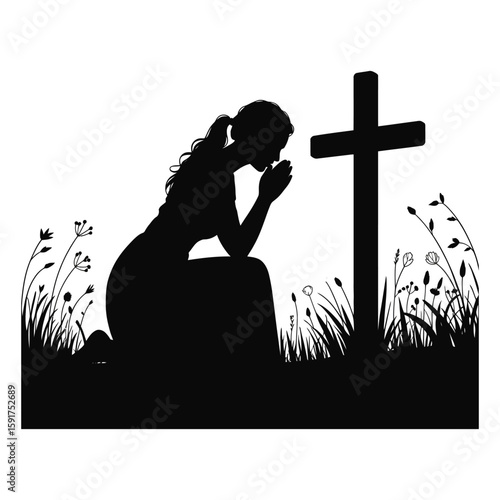 Silhouette of woman kneeling in prayer beside a cross in a field of wildflowers praying hands clasped