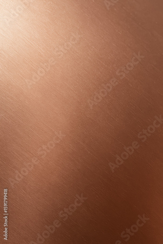 Close-up of shiny brushed copper metal surface texture