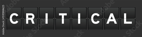 Black color analog flip board with word critical on gray background