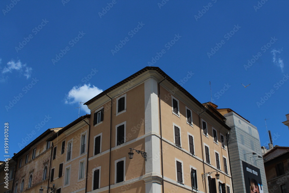 Fototapeta premium Cozy old street in Trastevere in Rome, Italy. Trastevere is rione of Rome, on the west bank of the Tiber in Rome, Lazio, Italy. Architecture and landmark of Rome Traditional ¨Rome buildings and houses