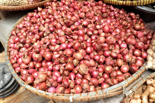 Fresh, mature red onion bulbs. Background of a bunch of red onions. Asian cooking spices.