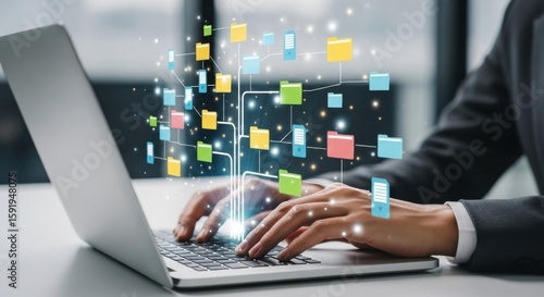 Person typing on laptop with colorful digital data folders and network connections technology