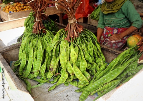 Принти на полотні Petai also known as green stinky beans, being sold fresh and unpeeled at a traditional market