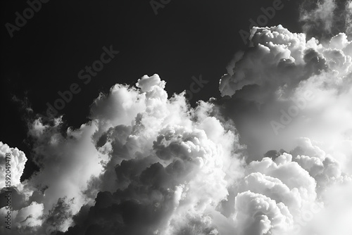 Dramatic black and white clouds fill the sky, showcasing stormy weather