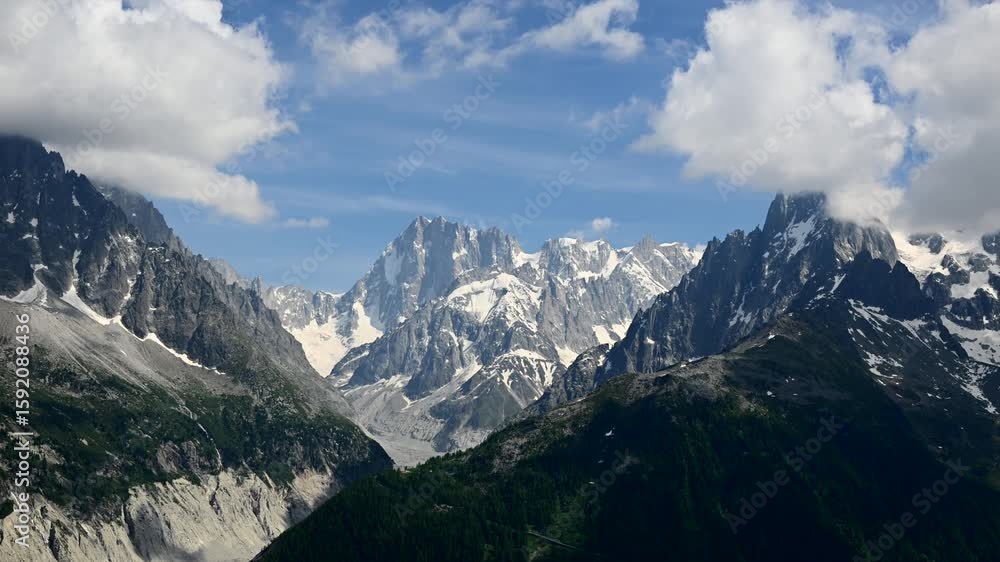 Timelapse of clouds rolling in above the glacier capped peaks of Le Mont Blanc in the French Alps