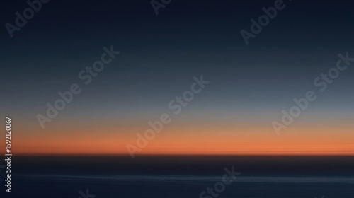Tranquil sunrise or sunset over calm water with gradient sky transitioning from deep blue to warm orange-red, sharp horizon line, serene minimalist atmosphere.
