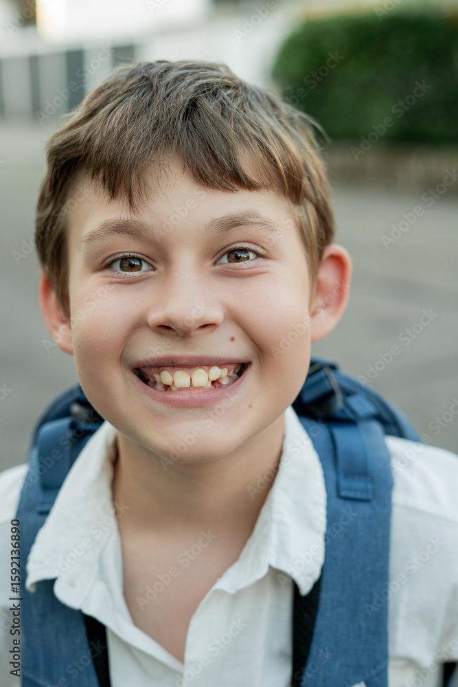 Portrait of a schoolboy with a backpack on the street. Back to school. Studying. Portrait of a schoolboy with a backpack on the street. Back to school. Studying.