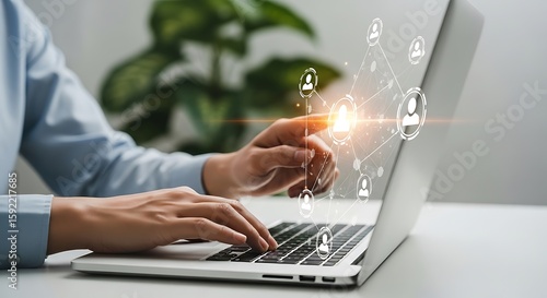 Illustration of person using a laptop with a digital network of people displayed